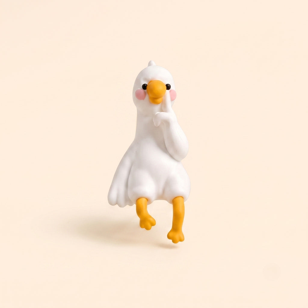 A clean studio hero shot of the By1994 mini duck figurine in the Thinking pose, featuring a white resin duck sitting thoughtfully with its finger on its beak on a light cream background.