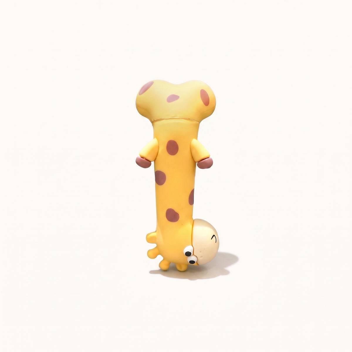 A whimsical studio view of the By1994 mini giraffe figure performing an inverted headstand pose, highlighting its playful silhouette and durable matte resin craftsmanship.
