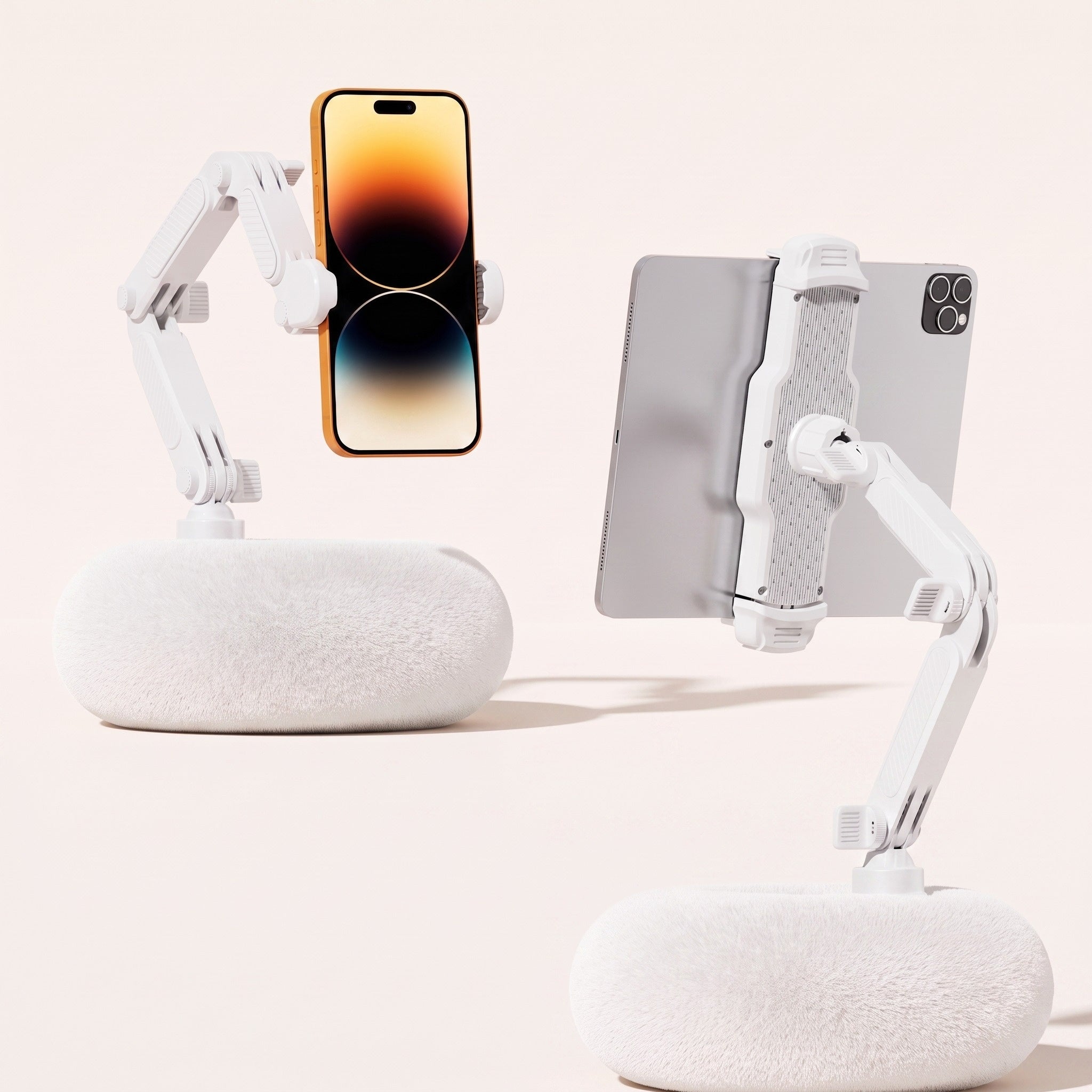 A side-by-side product comparison showing two By1994 Ivory White plush pillow stands, one holding a mobile phone vertically (Standard size) and the other supporting a large tablet horizontally (Large size) to demonstrate dual-size utility.