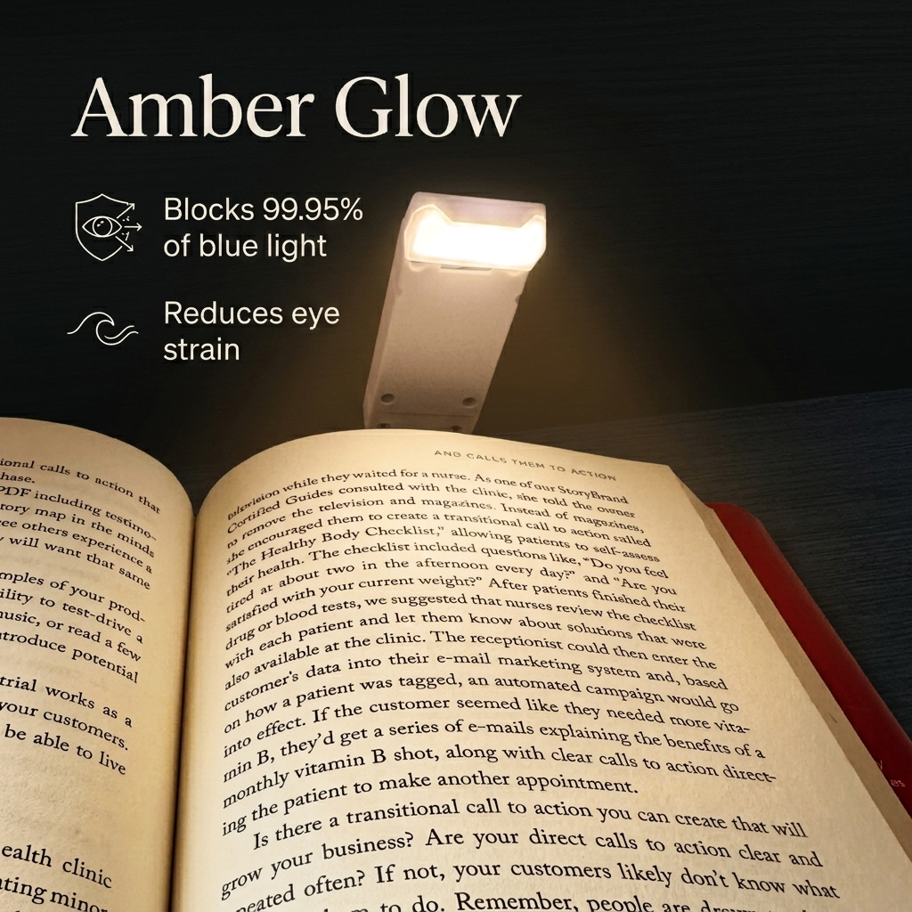 A detailed aesthetic shot demonstrating the protective amber glow of the portable book light clipped to white book pages at night, highlighting flicker-free eye protection and blue-light filtering technology.